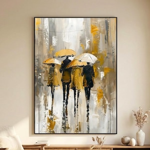Contemporary umbrella wall art print showing romantic figures under umbrellas in a rainy city scene, styled in a warm neutral living room with natural decor.