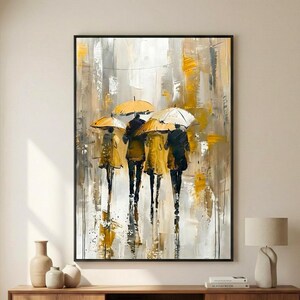 Abstract rain painting with yellow umbrellas and textured brush strokes, framed vertical wall art styled in a minimalist beige interior with wooden furniture.