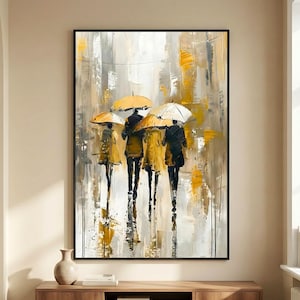 Modern umbrella wall art featuring abstract figures walking in the rain with yellow umbrellas, displayed above a wooden console table in a neutral contemporary living room.