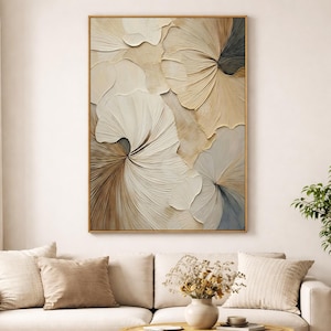 Neutral living room with textured 3D floral wall art in soft beige and white colors, displayed above a cream sofa for a modern minimalist home decor look.