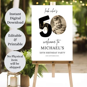 May include: A white sign with black text and a gold outline announcing a 50th birthday party for Michael. The sign has a photo of a man in the top right corner. The text reads "look who's fifty" and "welcome to Michael's 50th birthday party 22nd September 202X".