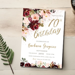 May include: A white invitation with a floral design in shades of burgundy and pink. The text reads "Join us for a 70th birthday, Celebration of Barbava Gregoire, September 20th from 5pm, 12345 Celebration drive, some city, CA, RSVP: Mona at 123-000-345".