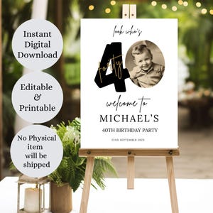 May include: A white welcome sign with black text and a gold outline. The text reads "Look who's forty" and "Welcome to Michael's 40th Birthday Party". A photo of a person is in a circle on the sign.