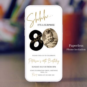 May include: A black and gold 80th birthday party invitation with a photo of a young boy. The invitation says "Shhh... It's a surprise" and includes the text "Please join us to celebrate Peterson's 80th Birthday, Sunday July 10 from 5pm, 12345 Celebration Drive, Birthday Hall, CA, RSVP Mona at 123-000-345". The invitation also says "Paperless Phone Invitation".