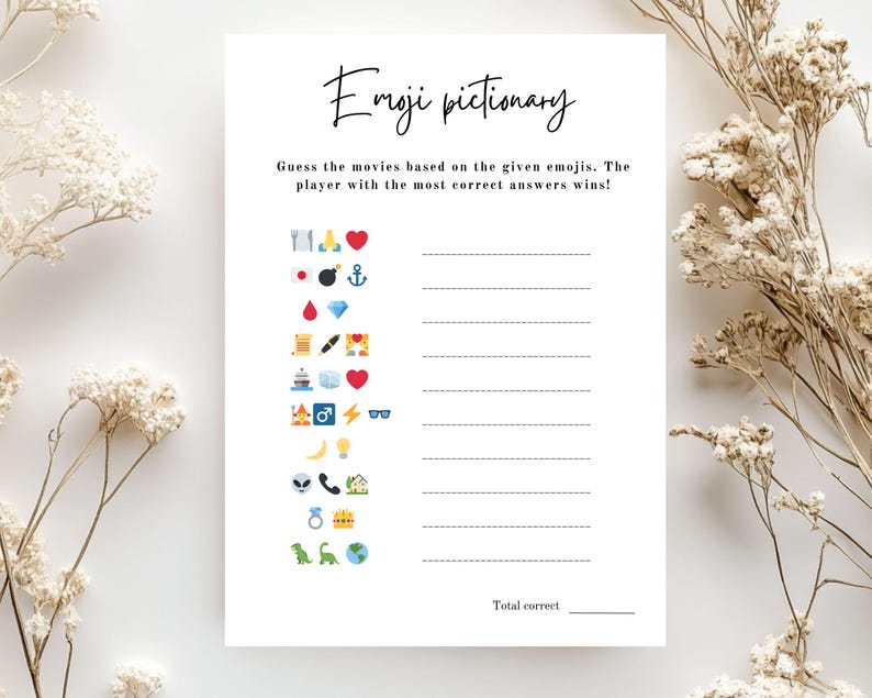 May include: A white Emoji Pictionary game sheet with the title in cursive script. The game includes a series of emojis to guess movies from, with lines for answers and a space for the total score. Decorative dried flowers are in the background.