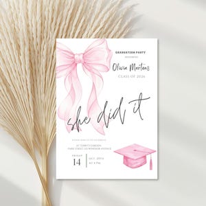 May include: A white graduation party invitation with a watercolor pink bow and a graduation cap illustration. The text reads "GRADUATION PARTY HONORING Olivia Martens CLASS OF 2026" and "she did it".