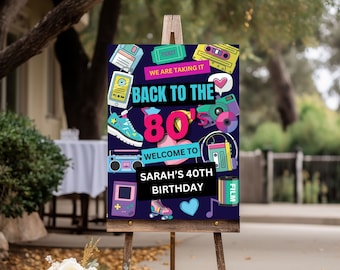 May include: A blue and black welcome sign with 80s themed graphics, including a cassette tape, a boombox, a camera, and roller skates. The text reads "We are taking it back to the 80's. Welcome to Sarah's 40th Birthday."