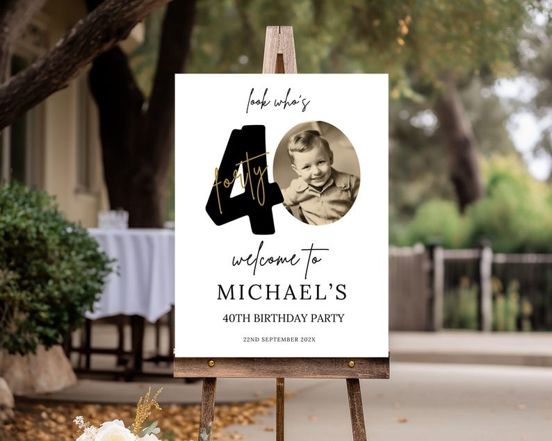 May include: Black and gold 40th birthday party welcome sign with a photo of a young boy. The sign says "Look who's forty" and "Welcome to Michael's 40th Birthday Party".