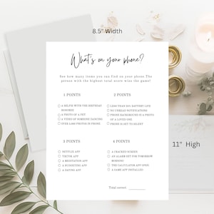 May include: A white paper game sheet with the text "What's on your phone?" and a list of items to find on your phone. The sheet is 8.5 inches wide and 11 inches high. The game is designed to see who can find the most items.
