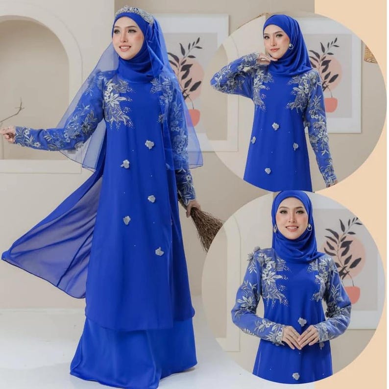 May include: A royal blue dress with floral embroidery on the sleeves and bodice. The dress features a matching head covering and a sheer overlay. The design includes small, decorative embellishments and a flowing skirt.