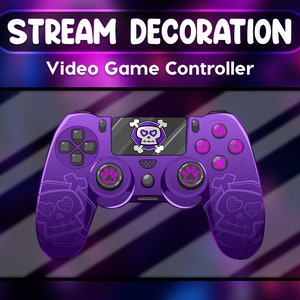 May include: A purple video game controller featuring skull and paw print designs. The controller has the words "STREAM DECORATION" and "Video Game Controller" in white text. The background is a gradient of purple and blue.