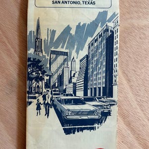 May include: Vintage travel brochure for San Antonio and Austin, Texas, featuring illustrations of cityscapes, cars, and people. The brochure includes the text "Visit Hemisfair '68" and the Texaco logo.