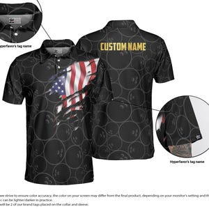 May include: Black polo shirt with a bowling ball pattern and a distressed American flag design. The shirt has a collar, buttons, and short sleeves. The back of the shirt has the text "CUSTOM NAME" in gold. The shirt is made of a lightweight fabric.