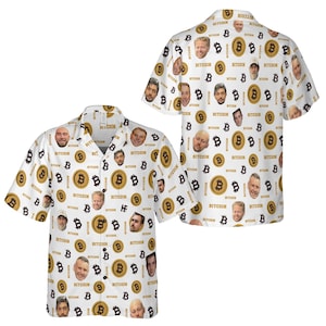 May include: White button-up shirt with a repeating pattern of Bitcoin symbols, faces, and the word "BITCOIN" in black. The short-sleeved shirt has a classic collar and button closure.