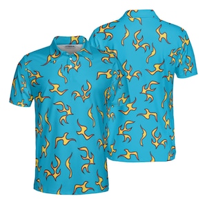 May include: A light blue polo shirt with a yellow flame pattern. The shirt has a collared neckline and short sleeves. The back of the shirt is also visible, showing the same flame design.