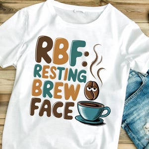 May include: White t-shirt with brown, teal, and orange text that reads "RBF: Resting Brew Face". A cartoon coffee bean with a face is above a teal coffee cup with brown coffee inside.