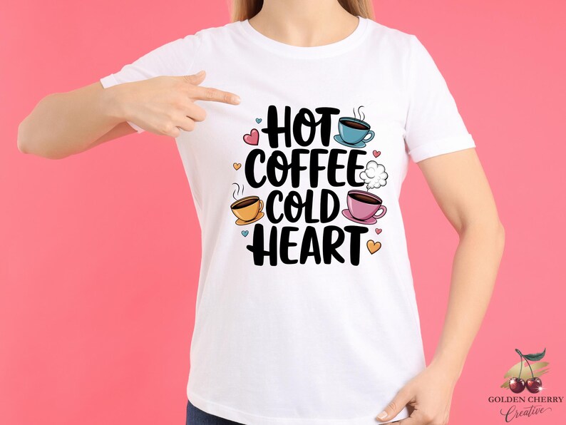 May include: White t-shirt with a graphic design that says "Hot Coffee Cold Heart" with illustrations of coffee cups and hearts.