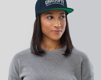 May include: A navy blue and green baseball cap with the text "CROSSFIT HALL STREET FIVE" embroidered in white.