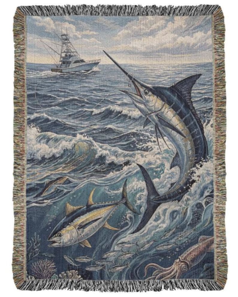 May include: Woven throw blanket featuring a marine scene with a marlin leaping from the ocean, a fishing boat, and other fish. The blanket has a fringe border and depicts a vibrant underwater world.