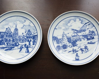 Set of 2 wall plates, Hutschenreuther Blue Porcelain Collector Plates Skate Scene Eltville Am Rhein, winter scene plates, white and blue