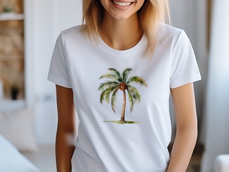 May include: White t-shirt with a watercolor illustration of a palm tree with a brown coconut.