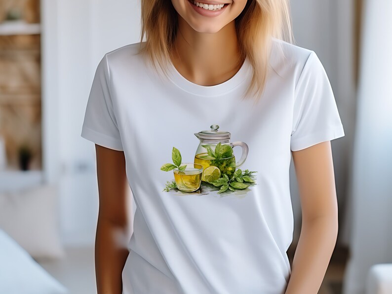 May include: White t-shirt with a graphic of a glass teapot and a glass of green tea with lemon and mint leaves.