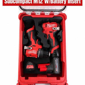 May include: A red Milwaukee PACKOUT storage case containing a black foam insert with cutouts for tools. The case holds a red M12 subcompact drill, an impact driver, and a battery. Text at the top reads Milwaukee PACKOUT Subcompact M12 W/Battery Insert.