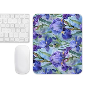 May include: A mouse pad with a watercolor design of purple iris flowers on a blue background.