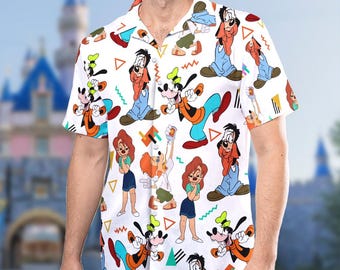 May include: A white short-sleeved button-up shirt with a colorful pattern of cartoon characters. The characters are all different variations of the Disney character, Goofy. The shirt has a collar and a button-up front.