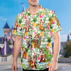 May include: A green and white short-sleeved button-up shirt with a tropical print featuring cartoon chipmunks, pineapples, and flowers.