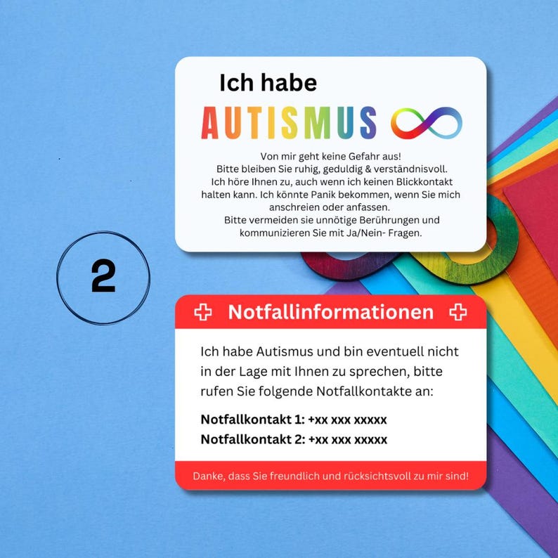 May include: A colorful card with the text "Ich habe Autismus" and an infinity symbol. The card also includes information about autism and emergency contact numbers. The card is designed to be used by individuals with autism to communicate their needs to others.