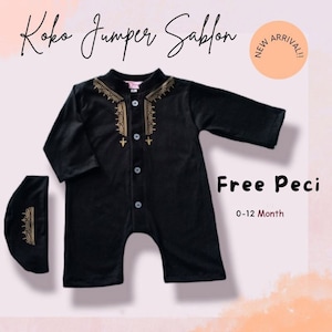 May include: Black baby onesie with gold embroidery and button fastening. It comes with a matching black hat. The onesie says "Koko Jumper Sablon" and "Free Peci 0-12 Month".