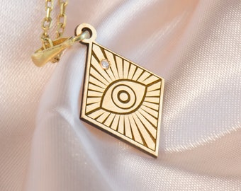 Ojo de Ra de oro macizo de 14 quilates con diamantes y protección ancestral.