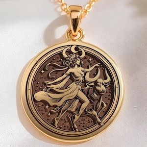 taurus woman zodiac gold pendant necklace, polished on raised relief elements; darkened (oxidized) recessed background areas, circular pendant with concentric ring border; central scene shows stylized female figure with flowing dress, floral headp...