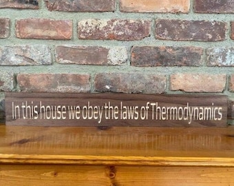 In this house we obey the laws of Thermodynamics sign