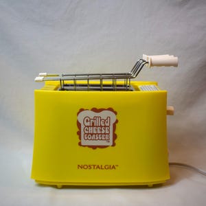 Tostapane Vintage Nostalgia Grilled Cheese modello NTCS2YW, nuovo, mai usato, senza scatola
