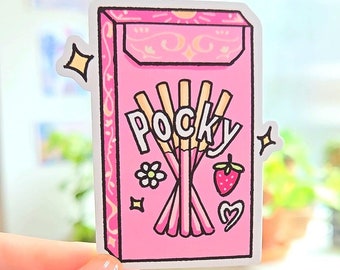 Puede incluir: Una pegatina rosa y blanca con una ilustración de dibujos animados de una caja de palitos de galletas cubiertos de chocolate Pocky. La caja tiene un fondo rosa con detalles decorativos blancos y amarillos. El texto "Pocky" está escrito en letras blancas en la caja. Hay pequeñas ilustraciones de dibujos animados de una flor, una fresa y un corazón en la caja.