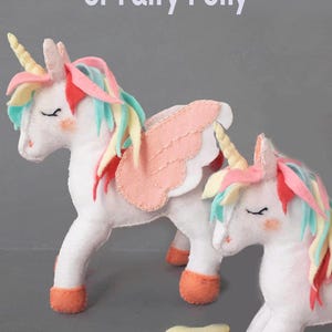 A group of two felt unicorns in different pastel colors (pink, blue, and purple) showing how the pattern can be customized.