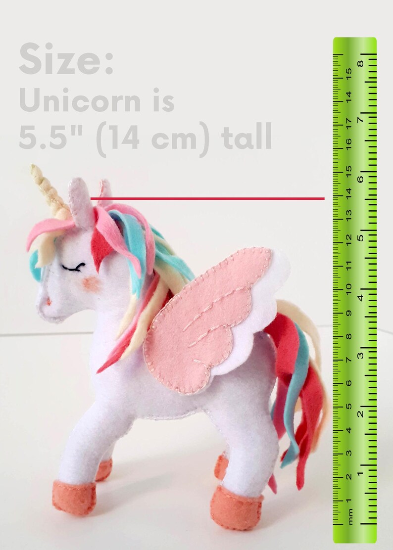 The finished 5.5-inch felt unicorn toy held in a hand to demonstrate its small, huggable size.