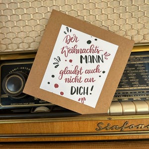 Digitales Weihnachts-Design "Der Weihnachtsmann glaubt auch nicht an dich" zum Bedrucken von Grußkarten/Bechern/Sweatern/Shirts usw.