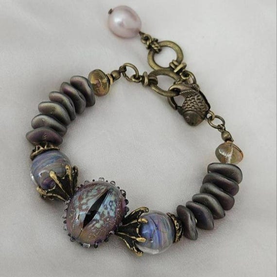 Handcrafted Gothic Snake Eye Bracelet - Artisan Lampwork Glass Fantasy Jewelry for Magic Lovers & Cosplay