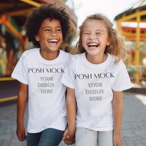 May include: Two children wearing white t-shirts with the text "POSH MOCK YOUR DESIGN HERE" printed on them. The children are smiling and holding hands.