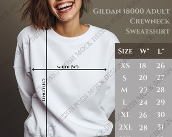 Puede incluir: Tabla de tallas para sudadera con cuello redondo para adultos Gildan 18000. La tabla muestra las tallas XS a 3XL con las medidas de ancho y largo correspondientes en pulgadas.