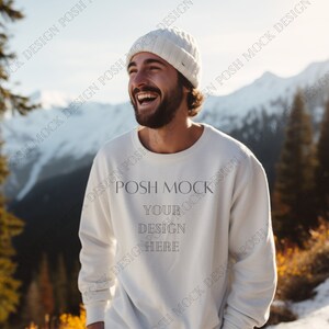 May include: A white crewneck sweatshirt with long sleeves. The sweatshirt has the text "POSH MOCK" and "YOUR DESIGN HERE" printed on the front.