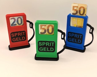 May include: Three miniature gas pump money holders, one red, one green, and one blue. Each has a slot for bills and a window displaying the amount, 20, 50, and 50 euros. The pumps have the text "SPRIT GELD" on them.