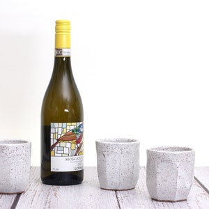 White speckled ceramic wine cups
