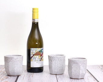 White speckled ceramic wine cups