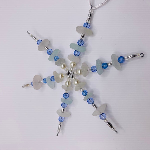 a beautiful Seaham sea glass star decoration. Sea foam and clear Seaham sea glass and pearl and blue beads used,