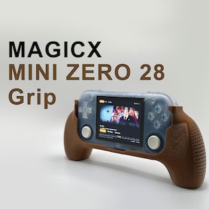May include: A brown handheld gaming console with a clear screen and a brown grip. The screen displays a video game with a group of people on it. The text "MAGICX MINI ZERO 28 Grip" is displayed above the console.