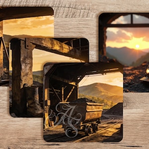 May include: A set of three square coasters featuring detailed imagery of a coal mine, including a dark hard hat with a light, a wooden support structure, and a metal cart filled with coal on tracks, all set against a sunset mountain landscape.